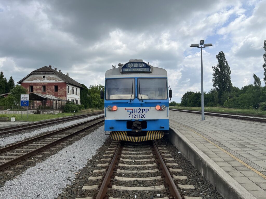 A blue and white train with the label 